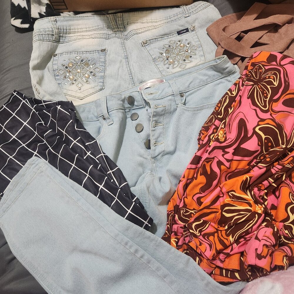 Lot of jeans, pants, and one dress